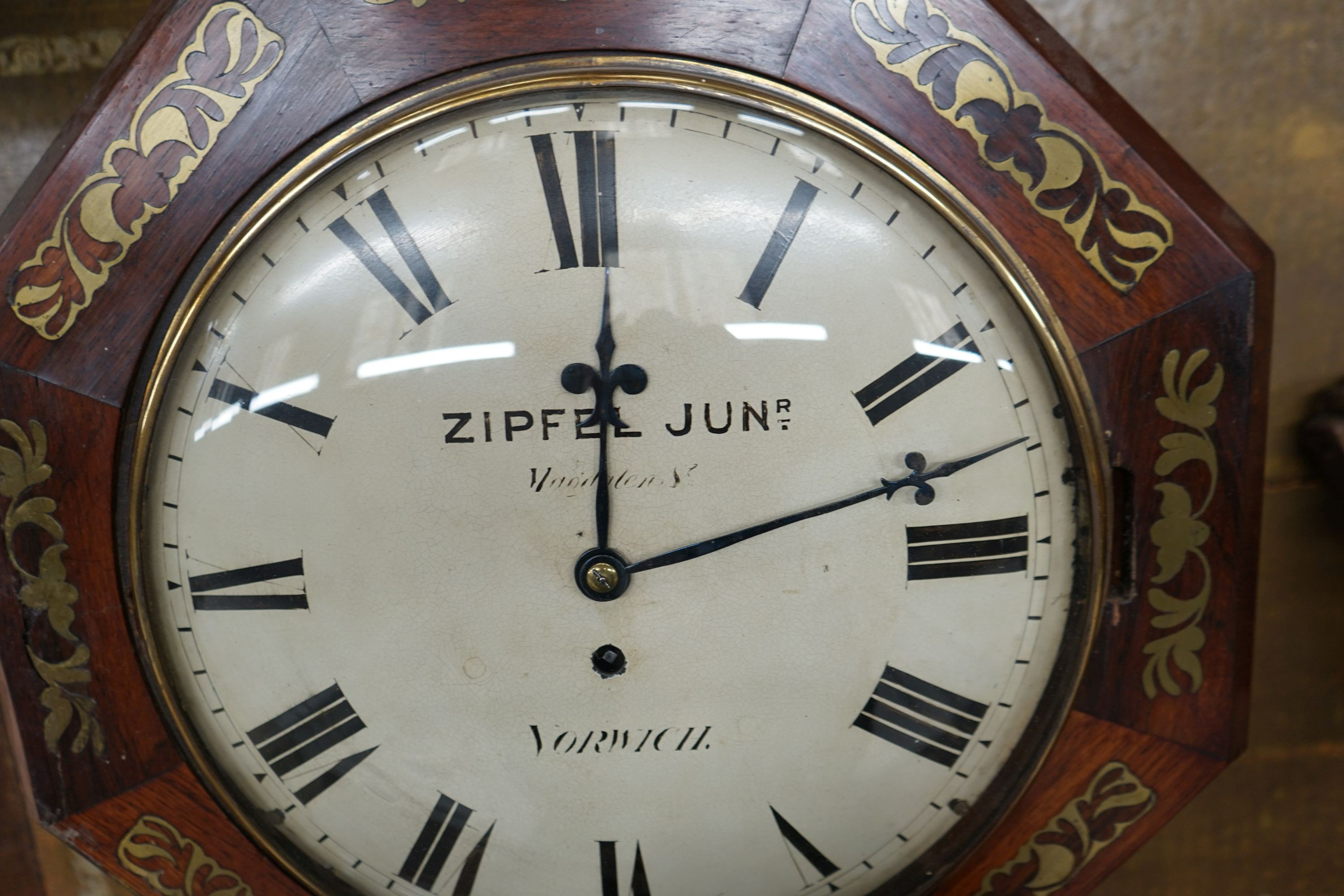 A Regency rosewood brass inlaid drop dial wall clock, width 44cm, height 60cm